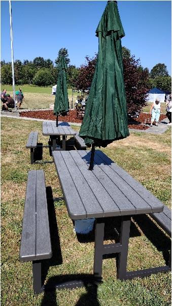 picnic tables with shade umbrellas