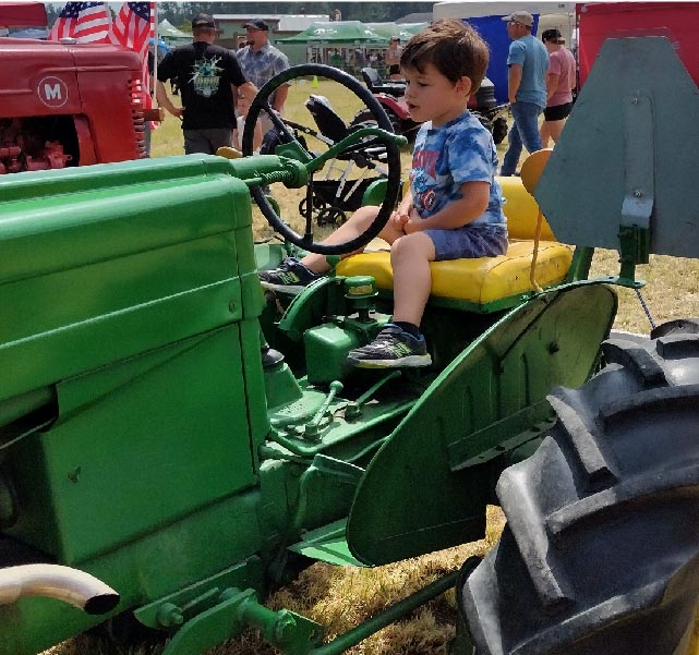 a younster on a tractor